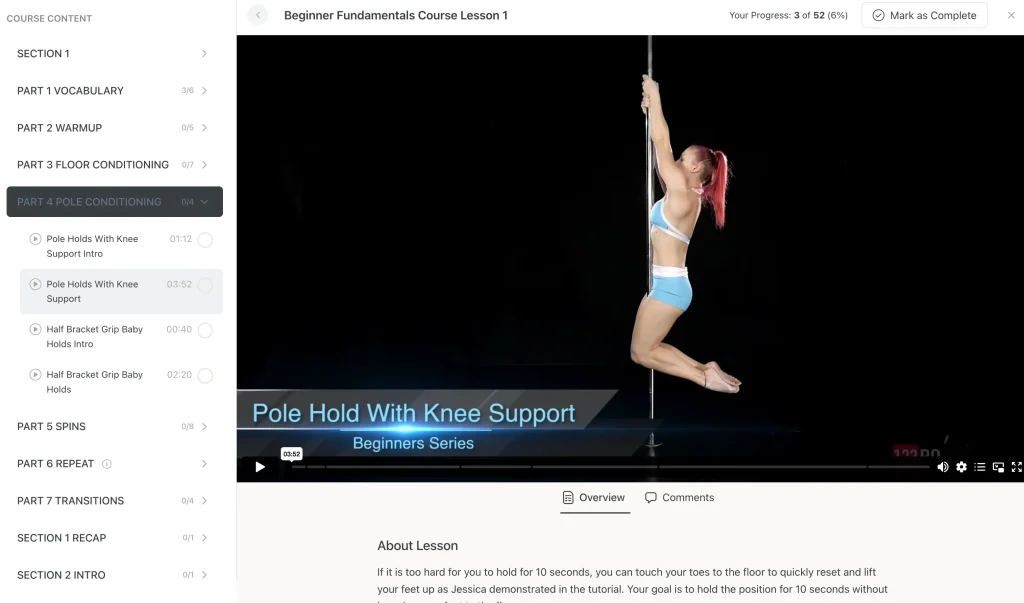 Inside view of a beginner pole lesson with play button and list of pole tricks and drills included in the class